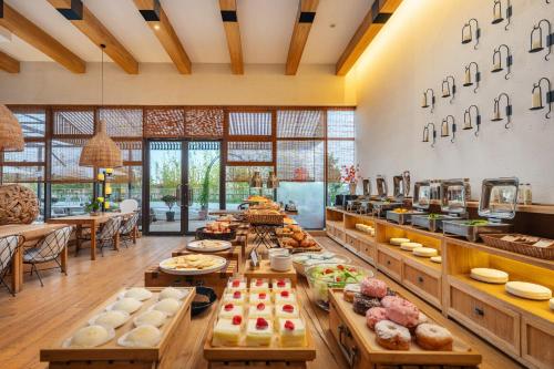 a bakery with a lot of food on display at Manli Hotel Shanghai Pudong Airport Branch -Provide free shuttle buses to Pudong Airport and Disneyland in Shanghai