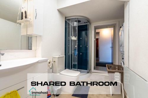a bathroom with a sink and a toilet in it at Sunny Home near Zurich Airport in Zürich