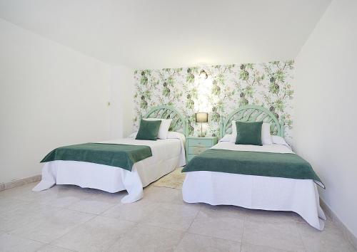 En eller flere senge i et værelse på Apartamento cerca del Paseo Marítimo de O Grove