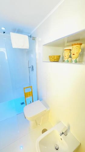 a bathroom with a toilet and a sink at Talamo Room Boutique in Naples