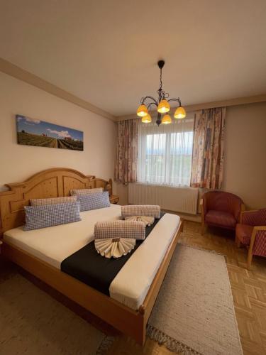 a bedroom with a large bed in a room at Weingut Giessauf-Nell in Klöch