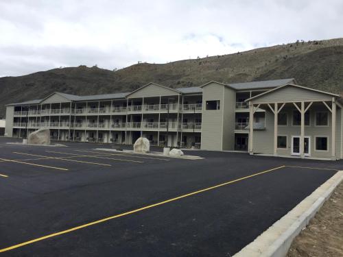 an empty parking lot in front of a hotel at Yellowstone Big Rock Inn in Gardiner