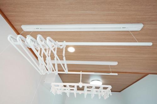 a chandelier hanging from the ceiling in a room at Takumi Renovated House Osaka Hirakata with Free Parking in Hirakata
