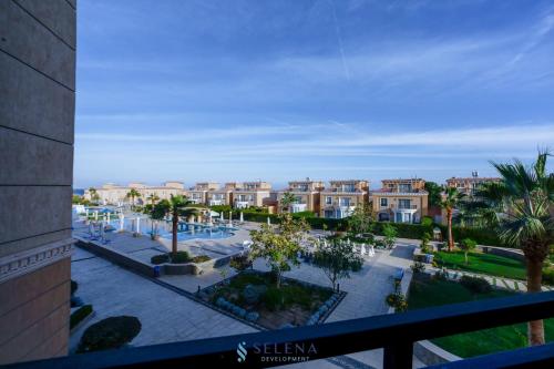 a view of a city with palm trees and buildings at Selena Bay Boutique Hotel in Hurghada