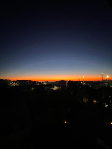 a sunset view of a city with the sky at Algarve 360º Experience in Loulé