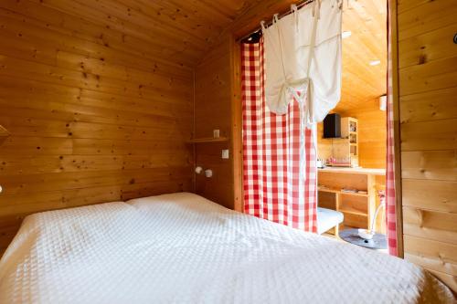 Postel nebo postele na pokoji v ubytování Tiny House