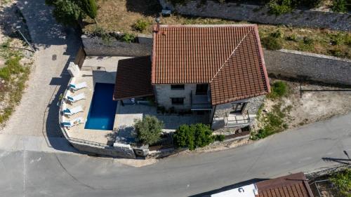 an overhead view of a house with a red roof at Stroumpi Private Pool Villa in Stroumbi