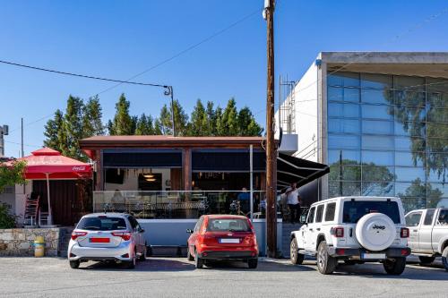 a group of cars parked in front of a building at Stroumpi Private Pool Villa in Stroumbi