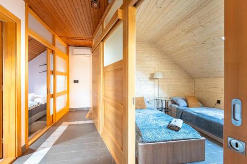 a small room with two beds and a couch at Kovács Présház Holdfény szállás in Nemesnádudvar