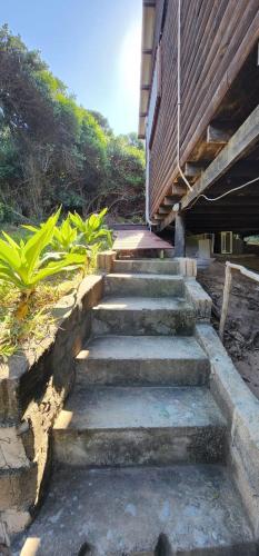 a set of concrete stairs next to a building at Xai Xai Mozambique, Fish Eagle, Xai Xai Beach Front in Xai-Xai