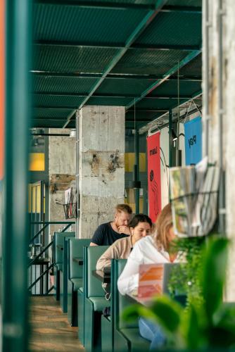 a group of people sitting at a table at The Social Hub Rotterdam Extended Stay in Rotterdam