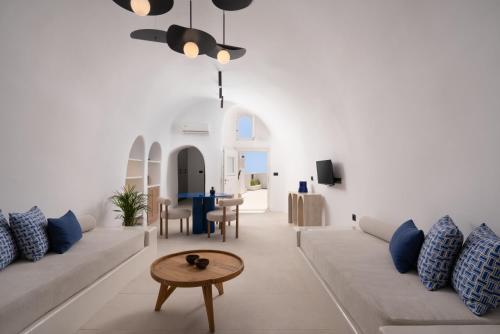 a living room with a couch and a table at U & ME SUITES in Fira