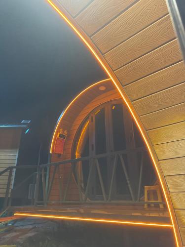 a building with a round window on the side of it at Đông Giang Sky Villa in A Sơ Ră Amo