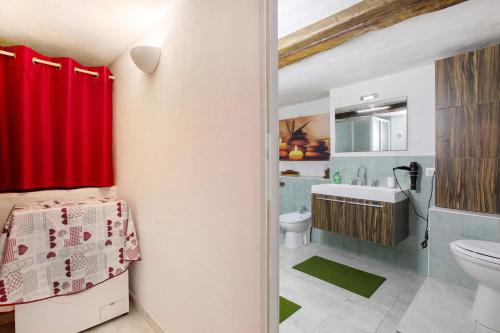 a bathroom with a toilet and a sink at Nel Cuore della Via Francigena in Aosta