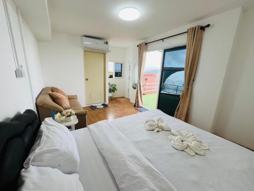 Postel nebo postele na pokoji v ubytování The View Homestay Monjam เดอะวิว โฮมสเตย์ม่อนแจ่ม
