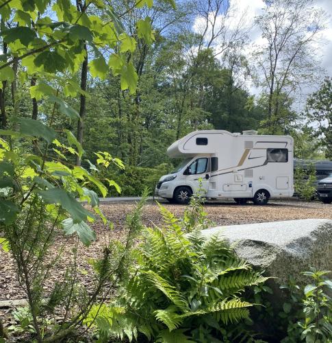 a white rv parked in a parking lot at Camping Vliegenbos in Amsterdam