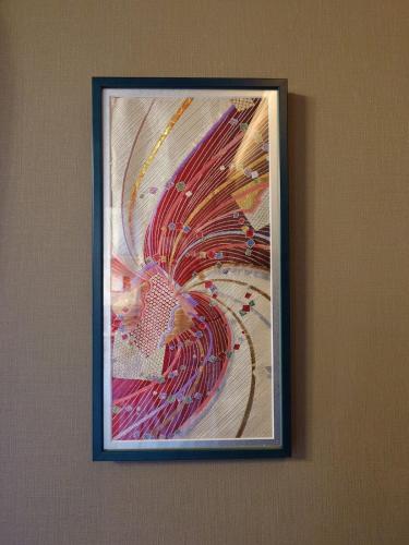 a picture of a painting hanging on a wall at Noctis豊田 ジャグジー肩湯付お風呂75型TV 最大12名宿泊可能 in Toyota