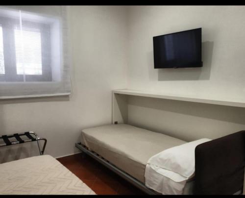 Ένα ή περισσότερα κρεβάτια σε δωμάτιο στο Dafne Home