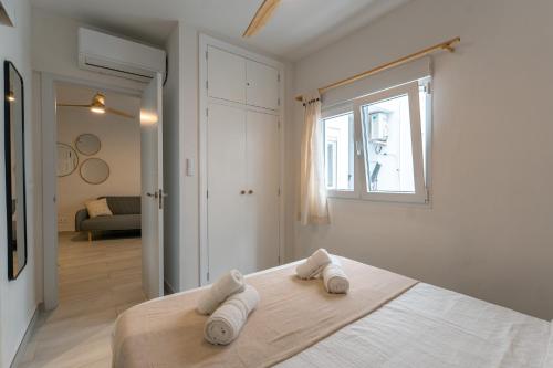 a bedroom with a bed with two towels on it at Ocean Apartment - Relaxing Centric Apartment in Moraira in Moraira