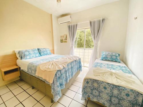 Postel nebo postele na pokoji v ubytování Apartamento amplo perto da Praia da Litorânea - Carmona Temporadas