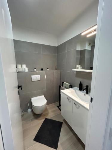 a bathroom with a toilet and a sink at Apartman Romina in Pula