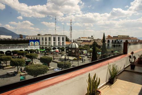 a view of a city from a balcony at Mansion de los Abuelos in Atlacomulco de Fabela