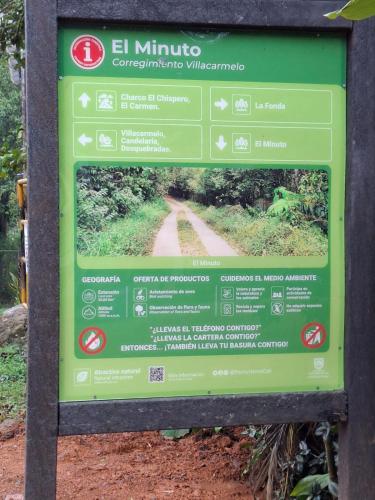 a sign on the side of a dirt road at Glamping Montaña de Sueños in Cali