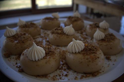 a plate of cupcakes with marshmallows on it at Pampa Lodge, Quincho & Caballos in Torres del Paine