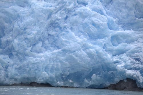 a close up of a large iceberg in the ocean at Pampa Lodge, Quincho & Caballos in Torres del Paine