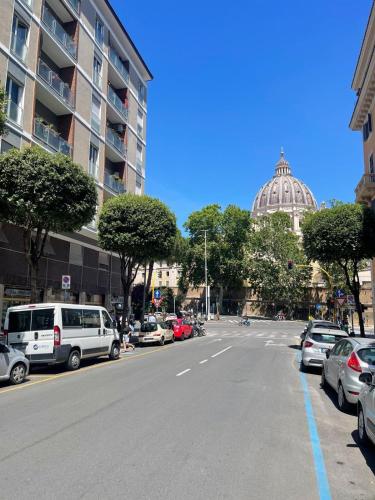 a street with cars parked on the side of the road at Il Perugino Guest House in Rome