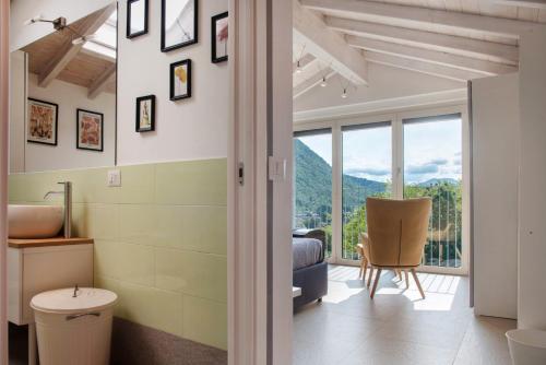 a bathroom with a view of a mountain at Residenza La Fonte in Laveno-Mombello