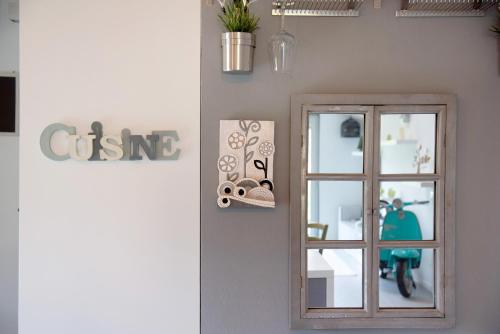 a room with a mirror and a window at Residenza La Fonte in Laveno-Mombello