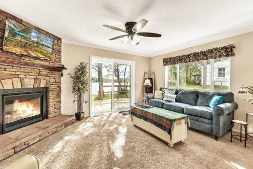 a living room with a couch and a fireplace at Hidn LakeFront-New Build-Private Beach-Fast Wi-Fi in Brighton