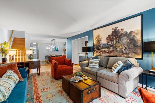 a living room with a couch and a table at The Madison in Alexandria
