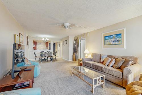 a living room with a couch and a table at Sea Colony - 706 Chesapeake House in Bethany Beach