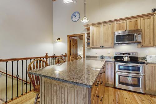 a kitchen with wooden cabinets and a counter top at Glen Land 7 in Bartlett
