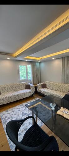 a large living room with couches and a table at Fethiye Çiftlik Villa in Fethiye