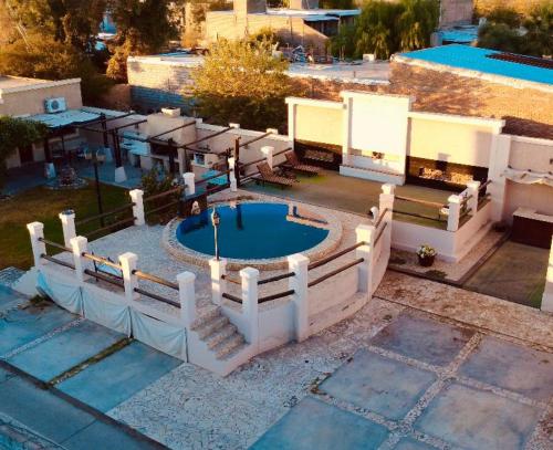 an aerial view of a swimming pool in a yard at El Aura l Complejo de apartamentos amoblados in Villa Krause