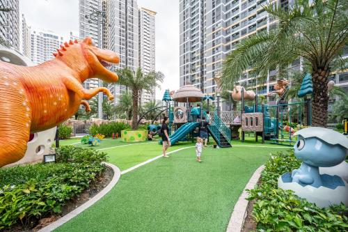 a child playing on a playground at a resort at Studio-GH5 - Vinhomes Grand Park - Thu Duc City in Long Bình