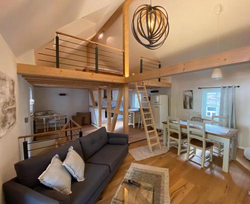 a living room with a couch and a loft at Ferienhaus Fachwerk Sanct Peter in Bad Neuenahr-Ahrweiler