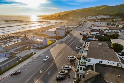 an aerial view of a town next to the beach at The Cayucan Bungalows by AvantStay Pet-Friendly Getaway Steps from Cayucos State Beach in Cayucos