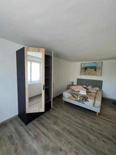 Ένα ή περισσότερα κρεβάτια σε δωμάτιο στο Appartement fonctionnel