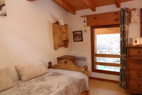 Ένα ή περισσότερα κρεβάτια σε δωμάτιο στο Chalet la Perle