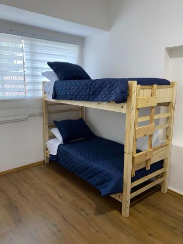Postel nebo postele na pokoji v ubytování Hostal San Benito Chile