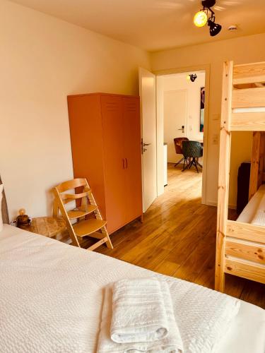 a bedroom with a bed and a bunk bed at Swiss City Apartments Rust in Rust