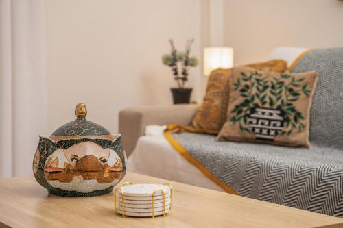 a living room with a table and a couch at Aegealis Stay in Samos