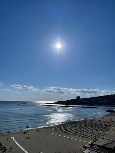 a view of a beach with the moon in the sky at Eri Apartments 4 in Shëngjin