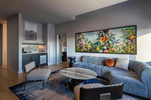 a living room with a couch and a table at W Austin in Austin