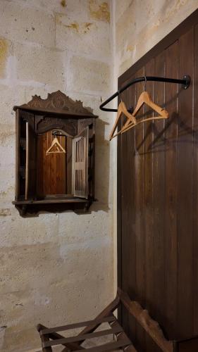 a mirror hanging on a wall in a room at Konak Bezirhane Cave Otel in Urgup