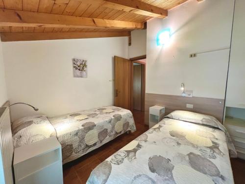 Postel nebo postele na pokoji v ubytování CROSINA HOLIDAY - Casa Lucia